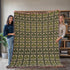 Shamrock Clover Blanket, a woven cotton blanket with green shamrocks and clover